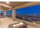 Expansive balcony with a stunning night view of the city and stylish outdoor seating at 286 Shaded Canyon Dr, Henderson, NV 89012