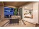 Relaxing balcony area with a fire pit and comfortable seating, seamlessly connected to the bedroom indoors at 286 Shaded Canyon Dr, Henderson, NV 89012