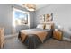 Calm bedroom with a gray and tan color scheme, inviting bed, and stylish decor at 286 Shaded Canyon Dr, Henderson, NV 89012