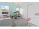 Bright bedroom with a pink chandelier, white trim, and large windows for plenty of natural light at 286 Shaded Canyon Dr, Henderson, NV 89012
