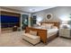 Serene bedroom with balcony access, soft lighting, and elegant furnishings for a cozy atmosphere at 286 Shaded Canyon Dr, Henderson, NV 89012