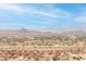 Expansive city view showcasing the landscape and mountains under a bright blue, partly cloudy sky at 286 Shaded Canyon Dr, Henderson, NV 89012