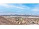Expansive city view with homes nestled in the foreground against a mountain range backdrop under a blue sky at 286 Shaded Canyon Dr, Henderson, NV 89012