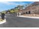 Community entrance with gate, landscaping, and mountain views at 286 Shaded Canyon Dr, Henderson, NV 89012