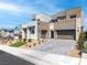 Contemporary two-story home with modern landscaping and a paved driveway at 286 Shaded Canyon Dr, Henderson, NV 89012