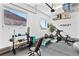 Garage with fitness equipment, storage racks, rubber flooring and great natural light at 286 Shaded Canyon Dr, Henderson, NV 89012
