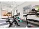 Garage with fitness equipment, rubber flooring, and natural light at 286 Shaded Canyon Dr, Henderson, NV 89012