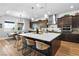 A modern kitchen features a large island with seating, pendant lighting, and stainless steel appliances at 286 Shaded Canyon Dr, Henderson, NV 89012
