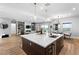Open-concept kitchen with island, stainless steel appliances, a view, and seamless flow to living area at 286 Shaded Canyon Dr, Henderson, NV 89012
