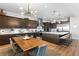 A gourmet kitchen boasts a center island, custom cabinetry, and adjacent dining area with stylish lighting at 286 Shaded Canyon Dr, Henderson, NV 89012