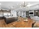 Open-concept kitchen with a large island, stainless steel appliances, hardwood flooring, and an adjacent dining area at 286 Shaded Canyon Dr, Henderson, NV 89012