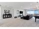 Bright, spacious living room with elegant decor, a large sectional sofa, modern entertainment unit, and a stunning view at 286 Shaded Canyon Dr, Henderson, NV 89012