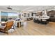 Bright living room with open floor plan, hardwood floors, and access to a balcony with panoramic views at 286 Shaded Canyon Dr, Henderson, NV 89012