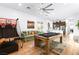 Open concept living room with a pool table, kitchen, comfortable sofa and entertainment area at 286 Shaded Canyon Dr, Henderson, NV 89012