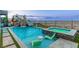 Resort-style pool with a waterfall feature, slide, and stunning city views at 286 Shaded Canyon Dr, Henderson, NV 89012