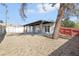 View of the backyard with detached storage unit and covered patio at 3017 Jamestown Way, Las Vegas, NV 89102