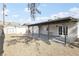 View of the backyard with detached storage unit and covered patio at 3017 Jamestown Way, Las Vegas, NV 89102