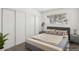 Bedroom with comfortable neutral decor, filled with natural light, and closet with sliding doors at 3017 Jamestown Way, Las Vegas, NV 89102