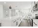 Modern kitchen featuring white countertops, cabinets, and a large island, with stainless steel appliances at 3017 Jamestown Way, Las Vegas, NV 89102