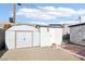 Two storage units in the backyard with brick walkway at 3017 Jamestown Way, Las Vegas, NV 89102