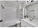 This bathroom features a shower-tub combo, white toilet, and modern vanity with plant accent at 3404 Winterhaven St # 204, Las Vegas, NV 89108