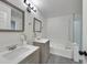A well-lit bathroom features a tub, shower, and dual sink vanities with mirrors at 3404 Winterhaven St # 204, Las Vegas, NV 89108