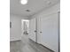 A cozy bedroom showcases gray floors, a bathroom view, and closet space at 3404 Winterhaven St # 204, Las Vegas, NV 89108