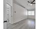A serene bedroom provides gray wood floors and bright window, ideal for relaxation at 3404 Winterhaven St # 204, Las Vegas, NV 89108