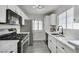 Modern kitchen featuring stainless steel appliances, white cabinets and countertops at 3404 Winterhaven St # 204, Las Vegas, NV 89108