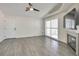 Living room has a fireplace, ceiling fan, and door to outside at 3404 Winterhaven St # 204, Las Vegas, NV 89108