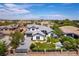 Stunning aerial view of a luxury home featuring well manicured landscaping, and multi-car garage at 3458 W Agate Ave, Las Vegas, NV 89139