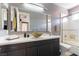 Modern bathroom featuring unique vessel sink, stylish vanity, and walk-in shower at 3458 W Agate Ave, Las Vegas, NV 89139