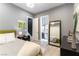 Stylish bedroom showing a doorway to bath, ensuite bath, and decor at 3458 W Agate Ave, Las Vegas, NV 89139