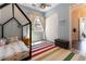 bedroom with vibrant colors, a playful rug, and a unique house frame bed at 3458 W Agate Ave, Las Vegas, NV 89139
