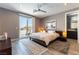 Bright bedroom with balcony access, ceiling fan, and modern decor at 3458 W Agate Ave, Las Vegas, NV 89139