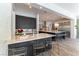 Modern kitchen featuring an island with bar seating, ample counter space, and high-end appliances at 3458 W Agate Ave, Las Vegas, NV 89139