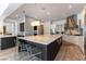 Open-concept kitchen with a large island, stainless steel appliances, and stylish pendant lighting at 3458 W Agate Ave, Las Vegas, NV 89139