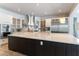 Modern kitchen with stainless steel appliances, large island, and white countertops at 3458 W Agate Ave, Las Vegas, NV 89139