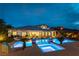 Stunning backyard with an illuminated pool, integrated hot tub, and well-maintained landscaping perfect for outdoor enjoyment at 3458 W Agate Ave, Las Vegas, NV 89139