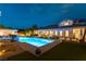 Beautiful backyard featuring a large, illuminated pool and manicured grounds perfect for relaxation and entertaining at 3458 W Agate Ave, Las Vegas, NV 89139