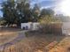Backyard featuring mature trees and block wall for privacy at 3491 S Bridle Way, Crystal, NV 89020