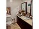 Bathroom features a vanity with sink, toilet, and linoleum flooring at 3491 S Bridle Way, Crystal, NV 89020