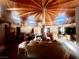 Spacious living room with wood beamed ceilings and unique architectural design at 3491 S Bridle Way, Crystal, NV 89020