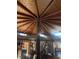 A unique living room with a striking wood-beamed ceiling at 3491 S Bridle Way, Crystal, NV 89020
