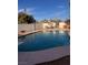 Refreshing backyard pool with diving board, bar and dining area at 3491 S Bridle Way, Crystal, NV 89020