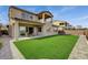 Enjoy the outdoors in this lovely backyard with a well-maintained lawn and paved patio for entertaining guests at 350 Gandara St, Las Vegas, NV 89138