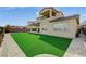 This backyard offers a serene retreat with a lush lawn and elegant landscaping, great for outdoor enjoyment at 350 Gandara St, Las Vegas, NV 89138