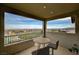 Outdoor balcony with table and chairs showing scenic city views under a partly cloudy sky at 350 Gandara St, Las Vegas, NV 89138