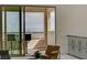 A balcony with seating offers scenic city views through large windows at 350 Gandara St, Las Vegas, NV 89138