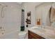 Bathroom featuring shower and tub combo with marble countertop sink at 350 Gandara St, Las Vegas, NV 89138